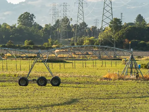Irrigation equipment across open green fields