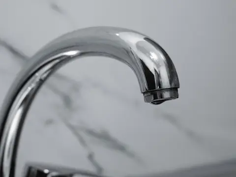 A kitchen tap with no water running